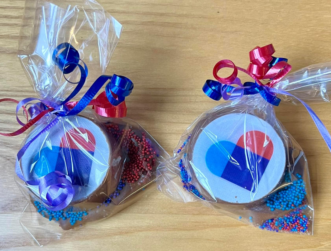 Customized Oreo Cookie with chocolate covered pretzel wrapped with ribbon